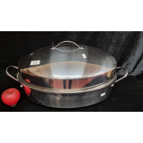 722 - A wonderful large 18 inch oval stainless steel roaster supplied with a raised and removable rack and... 