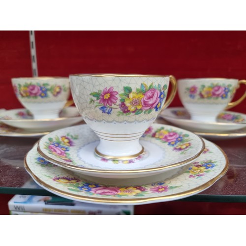 318 - A 20 piece Attractive tea set, with a lovely floral design, Thick gold band and gold handles.