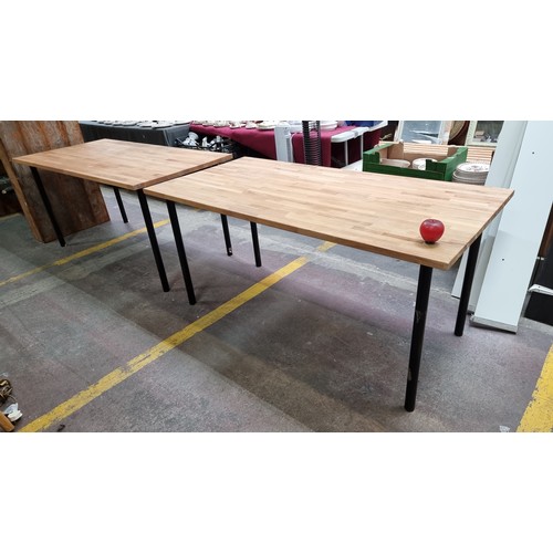 473 - A pair of  Ikea contemporary oak topped dining / desk tables with black tubular metal legs. In good ... 