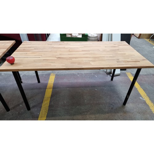 473 - A pair of  Ikea contemporary oak topped dining / desk tables with black tubular metal legs. In good ... 