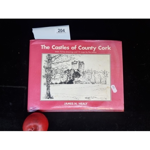 204 - Star Lot: A first edition hardback book titled 'The Castles of County Cork' by James N. Healy. With ... 