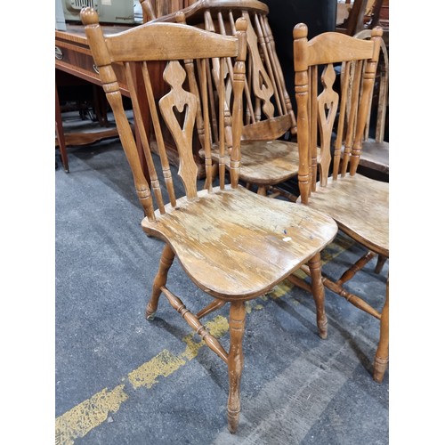 607 - Star Lot : A large stripped pine country kitchen table with five additional spindle back chairs.