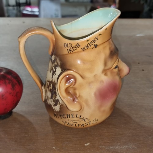 127 - A rare 1930s Mitchell’s & Co Belfast Irish whisky character jug.