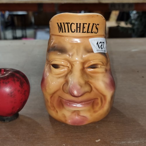 127 - A rare 1930s Mitchell’s & Co Belfast Irish whisky character jug.