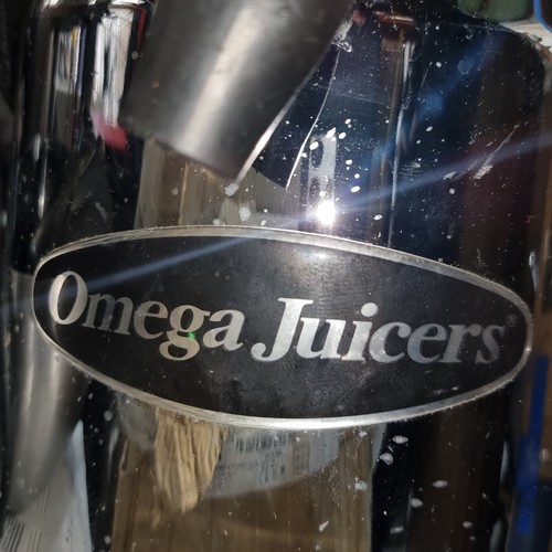 364 - Star Lot : A large counter top commercial Omega Juicer, ideal for crafting nutritious beverages with... 