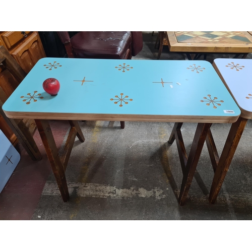 1000 - A very stylish dining table with a fresh blue top featuring a star pattern, held on robust wooden wo... 