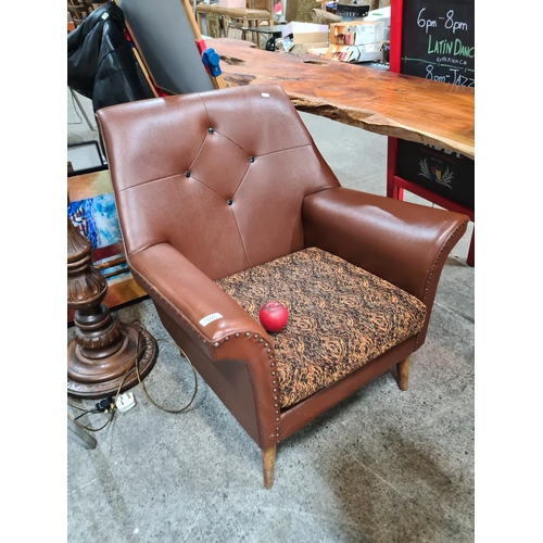 1020 - A fabulous vintage mid century armchair with diamond button back detail, angular frame, round tapere... 