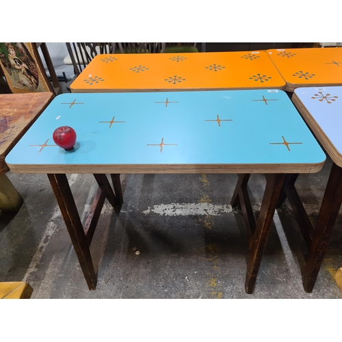 995 - A very stylish 4 seater dining table with a fresh blue top featuring a star pattern, held on robust ... 