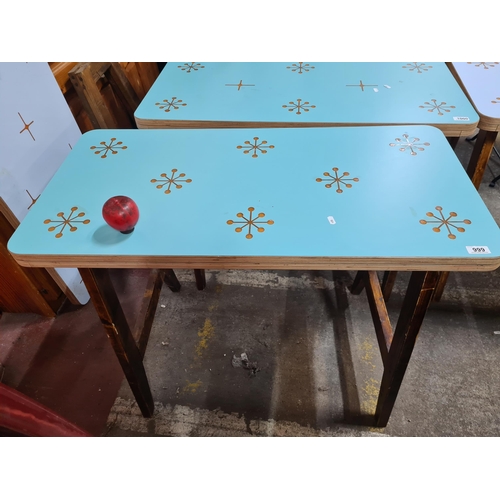 999 - A very stylish dining table with a fresh blue top featuring a star pattern, held on robust wooden wo... 