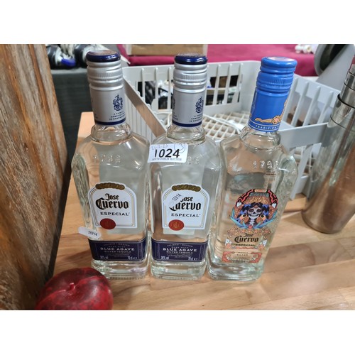 1024 - Two sealed 70cl bottles of Jose Cuervo tequila along with an unsealed limited edition 70cl bottle of... 