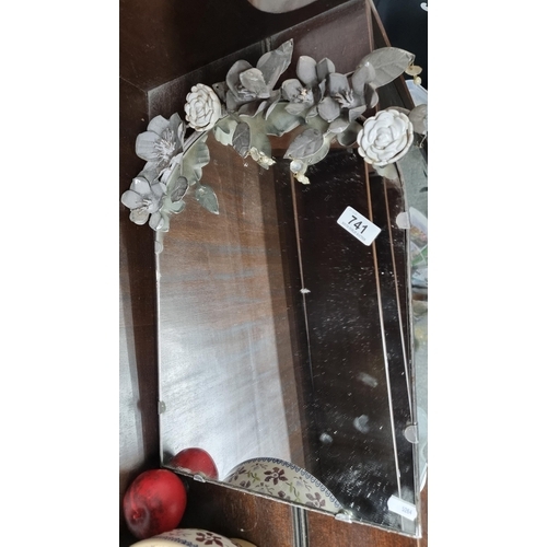 741 - A gorgeous vintage vanity mirror boasting ornate ceramic roses and metal lilies featuring faceted dr... 