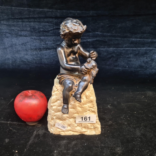 161 - A charming sculpture of a young boy feeding a bird. Held on a heavy stone base.