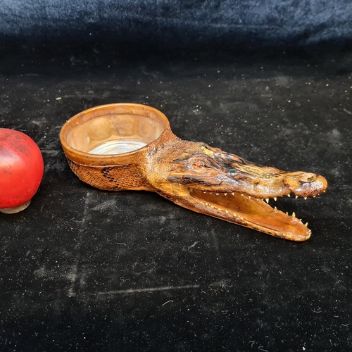 166 - A striking glass ashtray featuring a vintage taxidermy crocodile head boasting great detail.