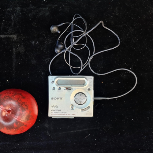 168 - A Sony Walkman Portable Minidisc Recorder model MZ-G755. Comes with headphones and Mini disc.