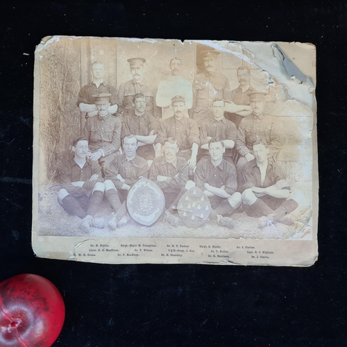 173 - An antique photograph depicting a British military sports team c. 1904-5. With their names listed to... 