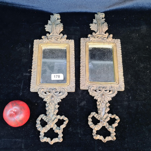 178 - A pair of unusual neatly sized wall mirrors held in Neoclassical style gilt frames with foliate and ... 