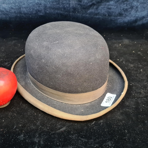 180 - A vintage bowler's hat made by R. Tyson makers of Racing Colours to M.M. Queen Elizabeth II. The sho... 