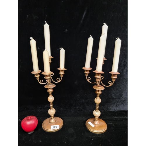 186 - A fabulous pair of tall ornate church brass three tier candlesticks. With Alabaster and brass stems,... 