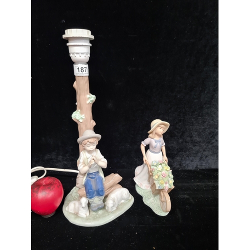 187 - Two beautiful porcelain items including a gorgeous Nao lamp and a figure of young girl pushing a whe... 