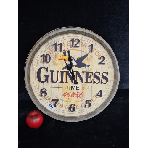 199 - A charming large Guinness advertising clock in the form of a coopered barrel lid.