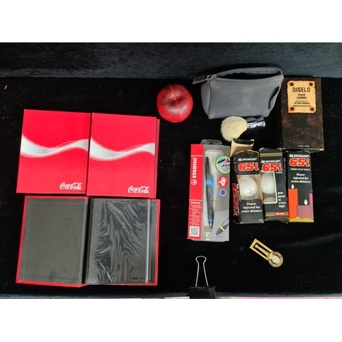 216 - A mixed lot of interesting items including three sleeves of Dunlop golf balls, Coca Cola folders and... 