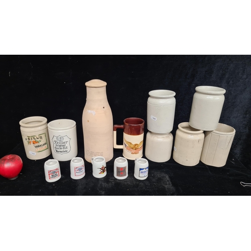 244 - An excellent collection of seven stoneware pots ideal for a rustic kitchen setting. Along with an Am... 