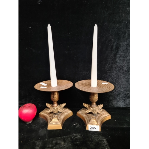 245 - A gorgeous pair of highly ornate brass candlesticks.