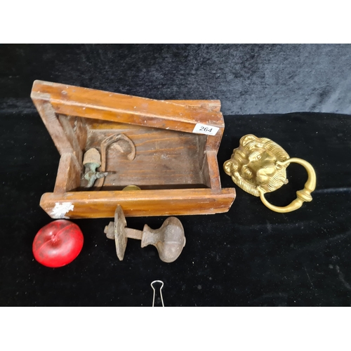 264 - A vintage wooden carpenter's tray holding a heavy brass lion Mask door knocker with knock plate, han... 