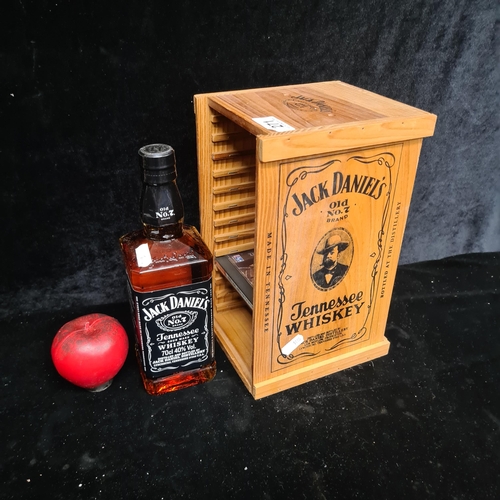 271 - A Jack Daniels Cd holder and a sealed bottle of Jack Daniels.