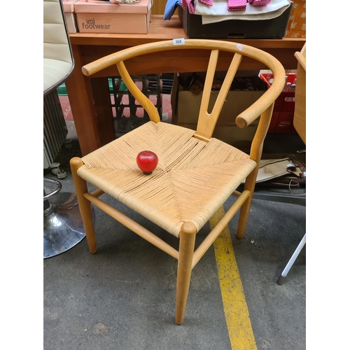 368 - A stunning ash wood wishbone chair after Hans Wegner. Classic Mid Century Modern design with bentwoo... 