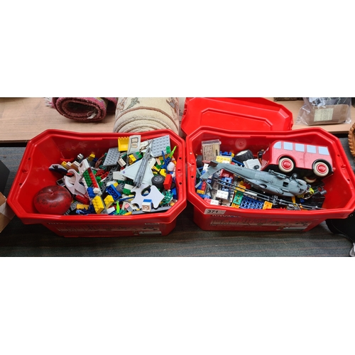 371 - Two boxes full of Lego and some model toy cars from Mattel and Majorette.