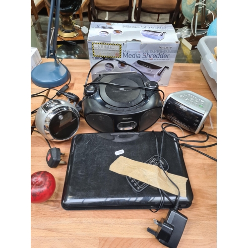 380 - A mixed lot of electrical items including a super retro Tevion Projection swivel design radio alarm ... 