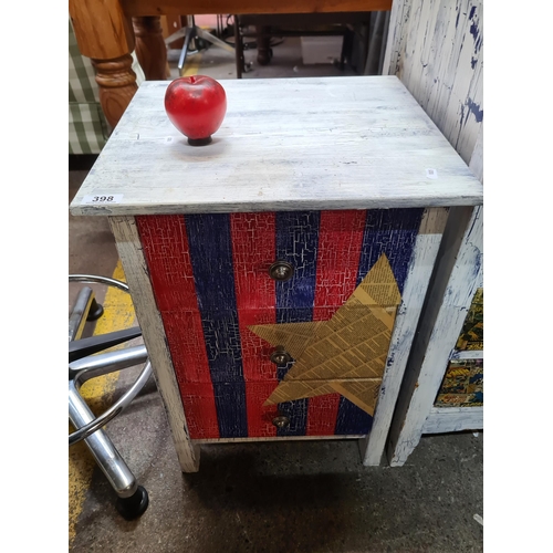 398 - An upcycled bedside locker with three drawers and metal handles.