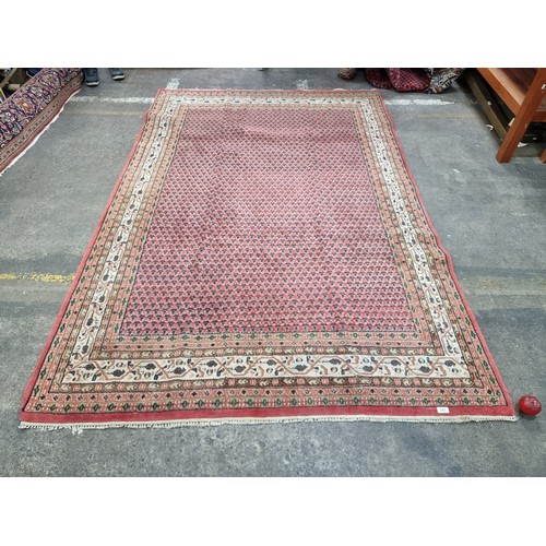 661 - Star Lot : A Fabulous very large Persian hand knotted woollen rug featuring a rich pattern in delica... 