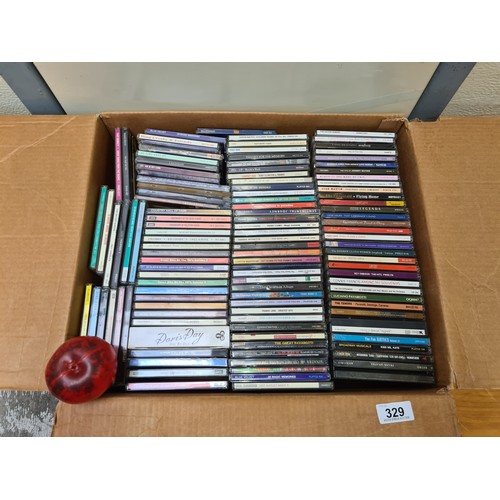 329 - A large assortment of vintage CDs including examples by artists such as Doris Day, ABBA, Pavarotti, ... 