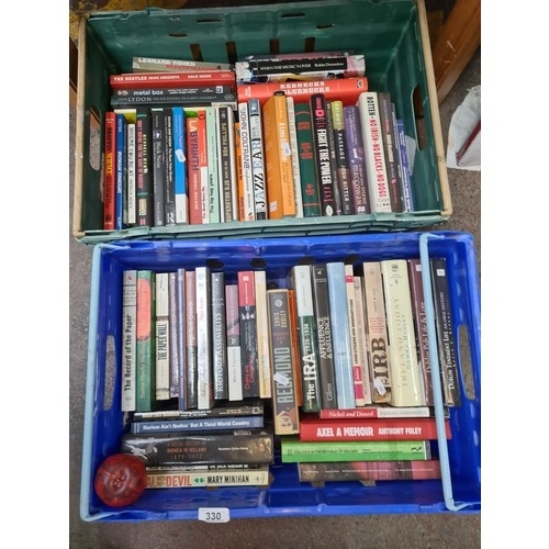 330 - Two crates filled with a large variety of books and publications including titles such as 