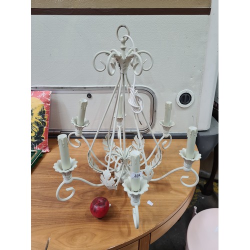 334 - A very chic wrought metal chandelier fitted with six branches. Features lovely scalloped drip trays ... 