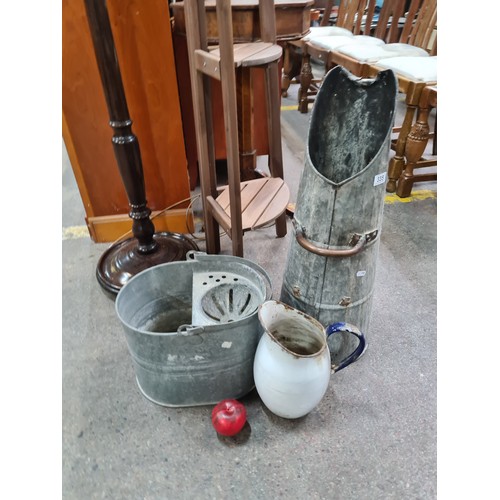 335 - Three vintage items including a coal scuttle, an enameled jug and a mop bucket.