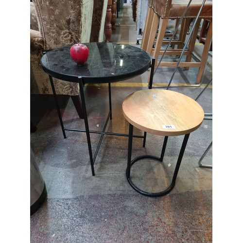 391 - Two elegant and modern contemporary side tables with black metal frame construction. One with a smok... 