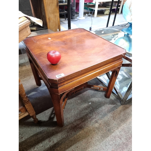 560 - A wonderful mahogany side table featuring a pierced stretcher.