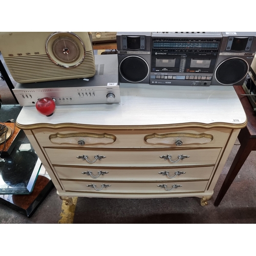 570 - A gorgeous large bedroom chest of drawers featuring three pull out drawers and metal handles.