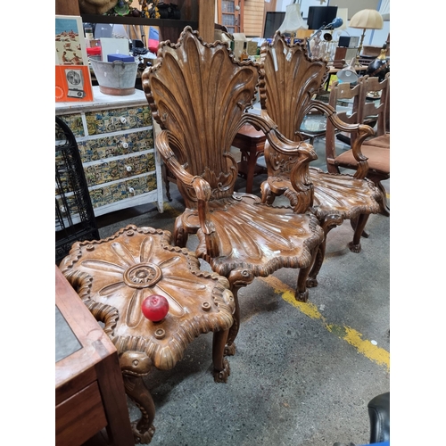 574 - Star lot : A magnificent pair of baroque armchairs carved in a scallop form along with matching side... 