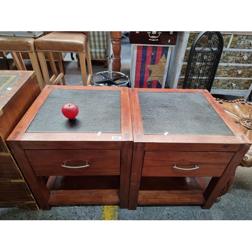 575 - A beautiful pair of bedside cabinets with leather tops and pull out drawer to front.