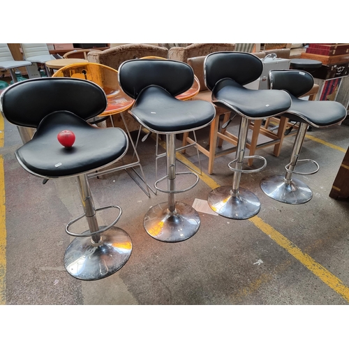 577 - Four very attractive height kitchen bar stools with adjustable seat and chrome base.