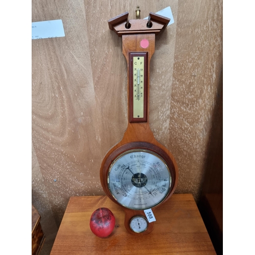 588 - A nice vintage weather master barometer in a wooden surround.