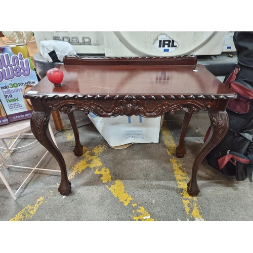 592 - A gorgeous rosewood console table with gallery back, cabriole legs and claw and ball feet. H80cm x W... 