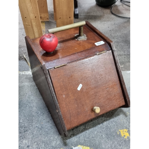 607 - An antique coal scuttle with brass handle and original liner.