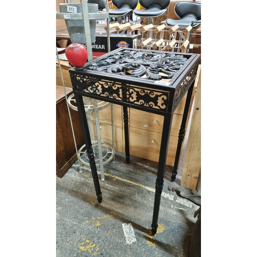 612 - A gorgeous cast metal plant stand boasting pierced floral detail to top.