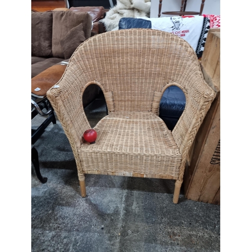 652 - A charming wicker armchair.