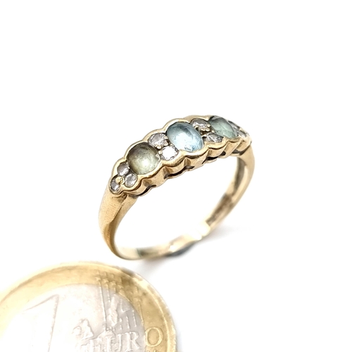 668 - Star lot : A good example of a 9K gold (375) aquamarine and diamond ring, size O, weight 2 grams.